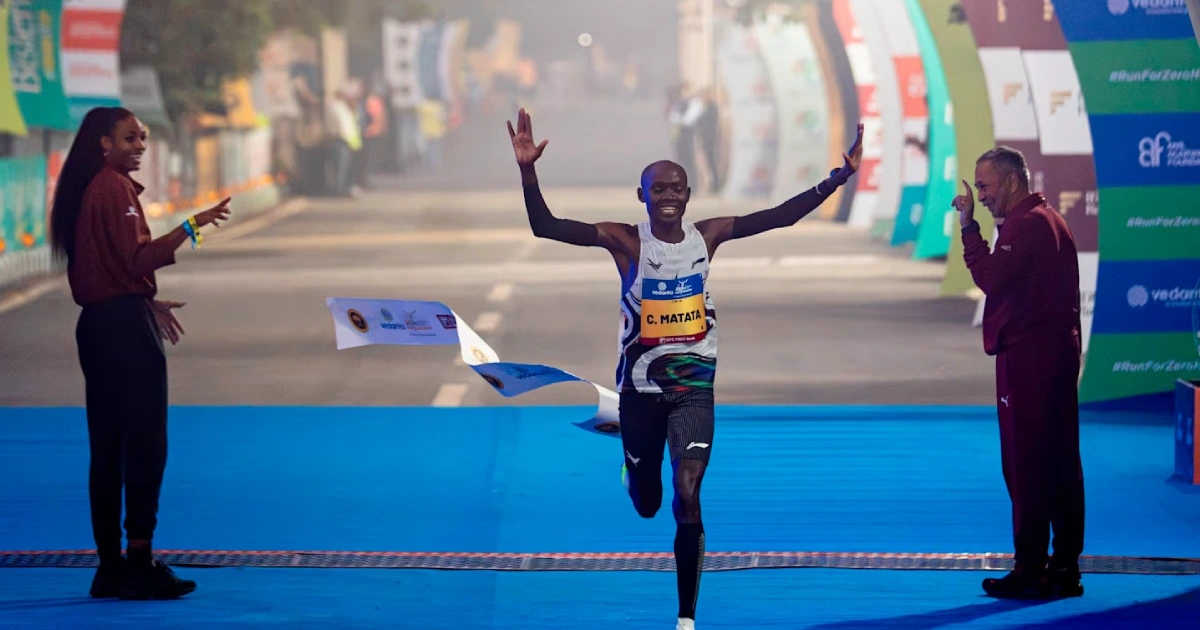 Charles Matata crosses the finish line to win the Vedanta Delhi Half Marathon 2026 in a course record of 58:52